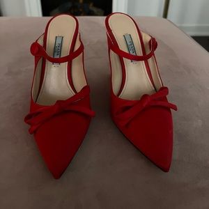 Red Prada heels, size 36 Euro, with an elegant ribbon.